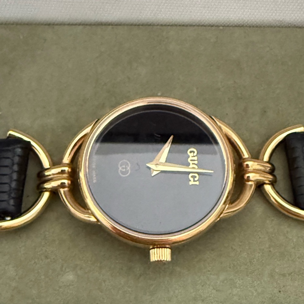 Gucci Black and Gold Bracelet Watch